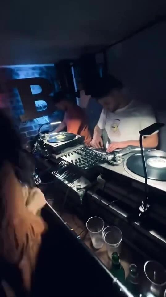 Eastern Bloc booth — analogue mixer, Technics, brick wall
